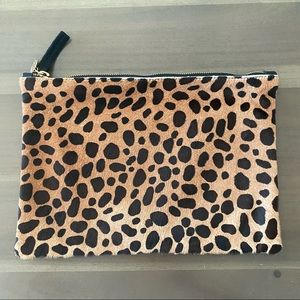 The Flat Clutch in Leopard Hair.